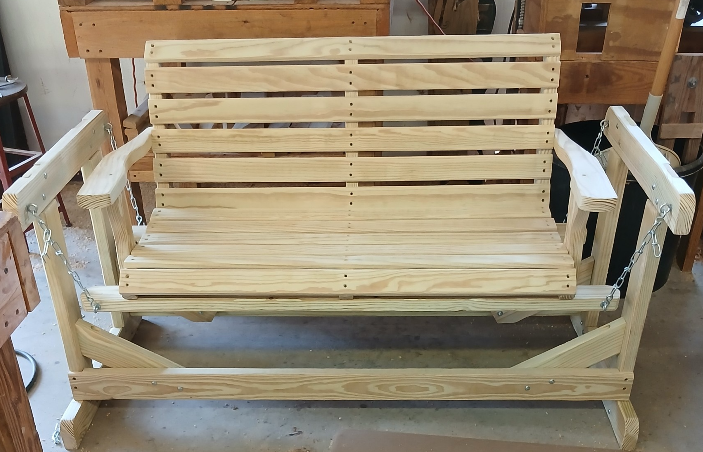 Real photo of a handcrafted wooden glider bench