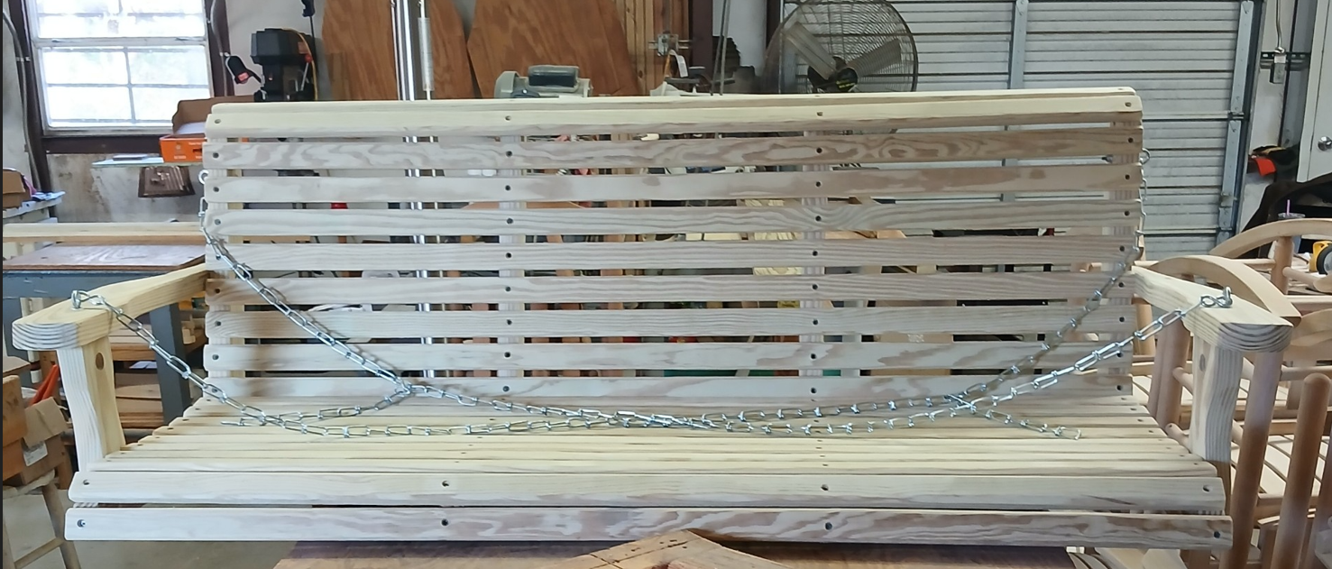 Real photo of a handcrafted wooden porch swing